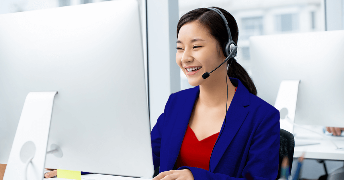 Business woman smiling during a conference call